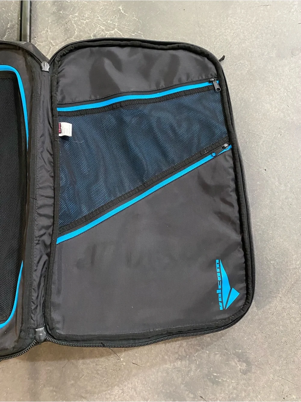 Volcom Black Carry-on Suitcase With a Geometric Grint and Electric Blue 22”x14”